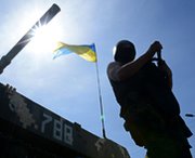A Ukrainian soldier stands guard on Sunday at a checkpoint near the eastern Ukrainian city of Slavyansk. Arms-control advocates on Monday said Russia and the United States should continue discussing new nuclear-weapon curbs, despite significant tensions.
