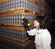 A worker in 2010 inspects mustard agent shells stored at the Pueblo Chemical Depot in Colorado. The U.S. Defense Department this week announced an anticipated two-year delay in eliminating chemical warfare materials stored at Pueblo and another installation in Kentucky (AP Photo/Ed Andrieski).