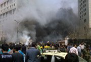 The aftermath of an April 8 car bombing in Damascus. British scientists are reported to have found evidence of a chemical arms attack near the capital city (AP Photo/Syrian Arab News Agency).