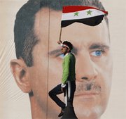 (Dec. 5) - A supporter of the Syrian government stands in front of a picture of President Bashar Assad on Friday. The United States is monitoring Syria's cache of chemical weapons amid concerns that warfare materials could be diverted to extremists or used against antigovernment protesters, officials said (AP Photo/Muzaffar Salman).