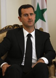 Syrian President Bashar Assad, shown during a 2009 trip to Iran. The United States and its allies are preparing contingency plans for a number of scenarios related to Syria's chemical arsenal, according to U.S. officials and experts (AP Photo/Vahid Salemi).