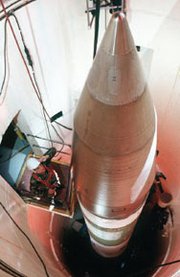 An Air Force sergeant inspects a Minuteman 3 missile, which uses the W-78 nuclear warhead. House and Senate lawmakers are not budging in debate over a proposed study on whether it would be cheaper to refurbish the W-78 or replace it with a Navy-interoperable warhead (U.S. Air Force/Los Alamos National Laboratory).