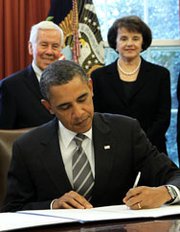 President Obama signs the New START arms reduction pact with Russia into law during a February 2011 Oval Office ceremony as then-Senator Richard Lugar (R-Ind.) and Senator Dianne Feinstein (D-Calif.) look on. Compromise legislation released this week does not restrict U.S. efforts to comply with the accord as much as some House Republicans had initially sought (Alex Wong/Getty Images).