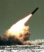 A U.S. Navy submarine test-launches a Trident 2 D-5 ballistic missile off the coast of Florida in 1989. Democratic lawmakers were expected on Wednesday to propose a bill intended to reduce U.S. nuclear weapons spending by $100 billion (AP Photo/Phil Sandlin).