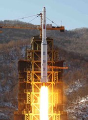 North Korea's Unha 3 space rocket lifts off in December 2012, in an image released by official state media. Recent satellite images of the country's Dochang-ri missile site indicate work is almost finished on a tower big enough to handle rockets larger than the one Pyongyang successfully launched into space more than a year ago.