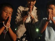 A mother and her children in Hiroshima, Japan, pray for atomic bomb victims on Aug. 6, 2013, the 68th anniversary of the U.S. bombing of the city. Nations supporting nuclear disarmament could unite this year in demanding a deadline date to start formal talks on a treaty that would ban all nuclear weapons.