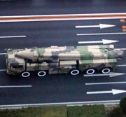 A military vehicle carries a Chinese DF-21D ballistic missile toward Beijing’s Tiananmen Square for a parade rehearsal in 2009. Deployments of the weapon might limit the potential movements of U.S. aircraft carriers, according to experts on China’s armed forces (AP Photo/Elizabeth Dalziel).