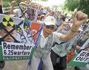 An activist takes part in an anti-North Korea demonstration last year in Seoul. U.S. National Intelligence Director James Clapper on Wednesday backed independent reports that Pyongyang appears to have restarted a reactor capable of producing nuclear-weapon plutonium.