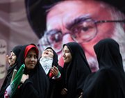 Iranian women pass a portrait of supreme leader Ayatollah Ali Khamenei outside the former U.S. Embassy in Tehran in 2012. Khamenei appears to have offered no concessions in an international standoff on Iran's uranium-enrichment capabilities, according to experts.