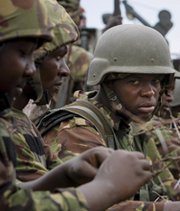 Kenyan military participants in an international peacekeeping mission ride on a truck in southern Somalia last October. Kenya and Uganda are receiving U.S. assistance to prepare for WMD strikes and similar incidents (AP Photo/African Union-U.N. Information Support Team).