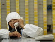 A worker passes communications from her station during a 2011 exercise at an atomic energy site in Taiwan's Wanli district. Taipei and Washington appear set to complete talks this year on an updated nuclear trade accord, according to a high-level U.S. State Department official (AP Photo/Wally Santana).