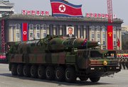 A North Korean vehicle transports a missile during an April military parade in Pyongyang. Japan possesses indications that China produced the mobile missile firing units displayed at the event, according to Japanese press reports from Wednesday (AP Photo/David Guttenfelder).