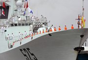 Navy sailors stand on the deck of the Chinese missile frigate Ma'Anshan as the ship docks at the port in Manila in spring 2010. A new U.S. military paper warns that Beijing might be tempted to arm its growing arsenal of cruise missiles with nuclear weapons to counter U.S. carrier strike groups.