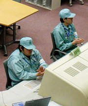 Employees work in 2004 at Japan's Rokkasho MOX facility. The United States reportedly has secretly pressed Japan to bolster security at the site, which is expected to generate plutonium of possible interest to extremists.
