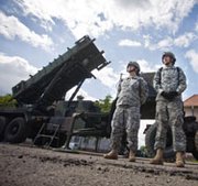 U.S. soldiers stand by a Patriot missile-defense battery in May 2010 at an army base in the northern Polish town of Morag. Poland on Thursday announced it would speed the selection of a vendor to provide the country with a domestic antimissile capability amid heightened concerns about Russian aggression.