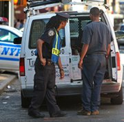 A New York Police Department officer searches a van following a radiological "dirty bomb" threat in August 2007 in New York City. A new expert report found negligence to be a factor in every documented incident last year in which radioactive materials either went lost or were stolen.