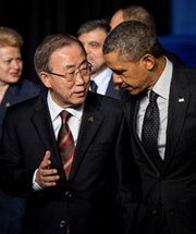 U.N. Secretary General Ban Ki-moon chats with U.S. President Obama after a group photo at the 2014 Nuclear Security Summit on Tuesday in The Hague, Netherlands. The U.N. head warned that the nuclear nonproliferation regime could be undermined by recent events in Ukraine.