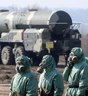 Russian military personnel stand near fueling equipment during a 2010 drill at a missile-forces research institute south of Moscow. Russia on Thursday launched a three-day nuclear war drill it said was scheduled last year.