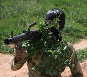 A Syrian opposition fighter takes part in a training exercise in the city of Deir Ezzor last week. A Syrian rebel group reportedly denied a Russian assertion that opposition forces are seizing coastal territory in a bid to thwart the removal of warfare chemicals from the country.
