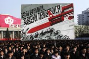 North Koreans rally on Thursday in Pyongyang to support a new government threat to abandon the 1953 Korean War armistice and claiming the North possesses "lighter and smaller nukes." The North on Thursday threatened nuclear strikes against South Korea and the United States in response to new sanctions from the U.N. Security Council (AP Photo/Jon Chol Jin).