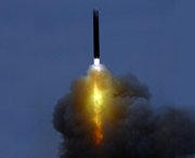 A Russian intercontinental ballistic missile is test-fired in this undated photo. President Vladimir Putin on Thursday oversaw a large-scale nuclear arms drill that involved the test-firing of strategic land- and sea-based missiles.