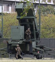 Japanese troops refuel a Patriot Advanced Capability 3 air-defense battery deployed in Tokyo last month during heightened tensions with North Korea. U.S. efforts to encourage Japan and South Korea to deepen their antimissile cooperation are being stymied by lingering World War II-era sensitivities and worries about antagonizing China (AP Photo/Shuji Kajiyama).