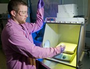 A researcher shows nuclear-forensics samples at the Argonne National Laboratory in Illinois. A new report recommends Russia and the United States establish procedures for sharing sensitive atomic-forensic data in order to counter the threat of nuclear terrorism (U.S. Argonne National Laboratory photo).