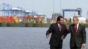 (Apr. 2) -Then-Assistant Commissioner of U.S. Customs Jayson Ahern speaks with former President George W. Bush at the Port of Baltimore in 2005 (Jim Watson/Getty Images).