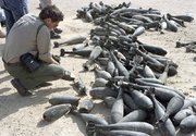(Apr. 27) -A U.N. inspector examines Iraqi chemical munitions in 1992. Iraq last month declared itself as a chemical weapons possessor state (U.N. photo).