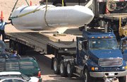 (May. 4) -A retired U.S. Minuteman 3 ICBM is removed from display in 2008. The United States yesterday asserted it possesses more than 5,000 nuclear weapons that remain in service (U.S. Defense Department photo).