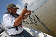 (Jun. 3) -A U.S. Environmental Protection Agency contractor conducts water tests Monday near the point where the Mississippi River reaches the Gulf of Mexico. The Obama administration has ruled out using a nuclear weapon to seal the oil that continues to flow into the gulf (Win McNamee/Getty Images).