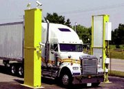 (Jul. 26) -A truck passes through an Advanced Spectroscopic Portal radiation detector. The United States has cut short an initiative to further develop and deploy the monitor system, a senior Homeland Security Department official said on Tuesday (Raytheon photo).
